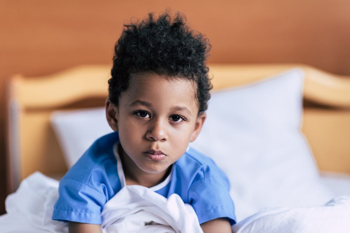 young Black child in hospital bed