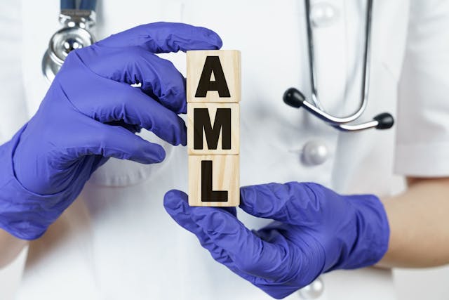 person holding AML letters wearing purple medical gloves | Image credit: ©Dzmitry  stock.adobe.com