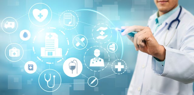 physician pointing at digital health icons | Image credit: Summit Art Creations stock.adobe.com