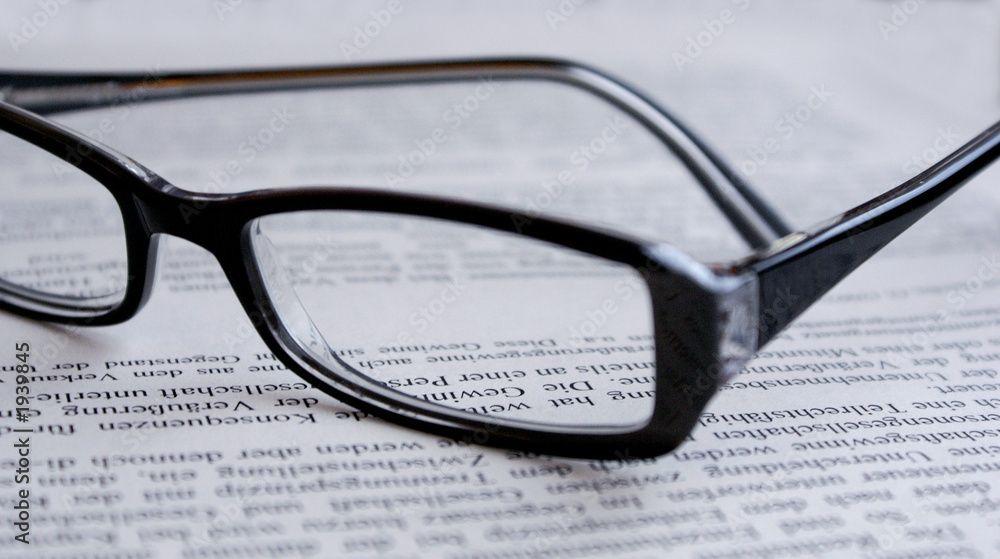 Glasses on printed page | Image credit: ©artpost stock.adobe.com