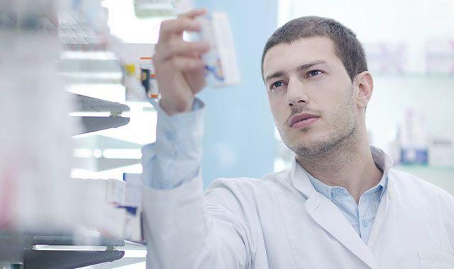 Pharmacist examining prescription