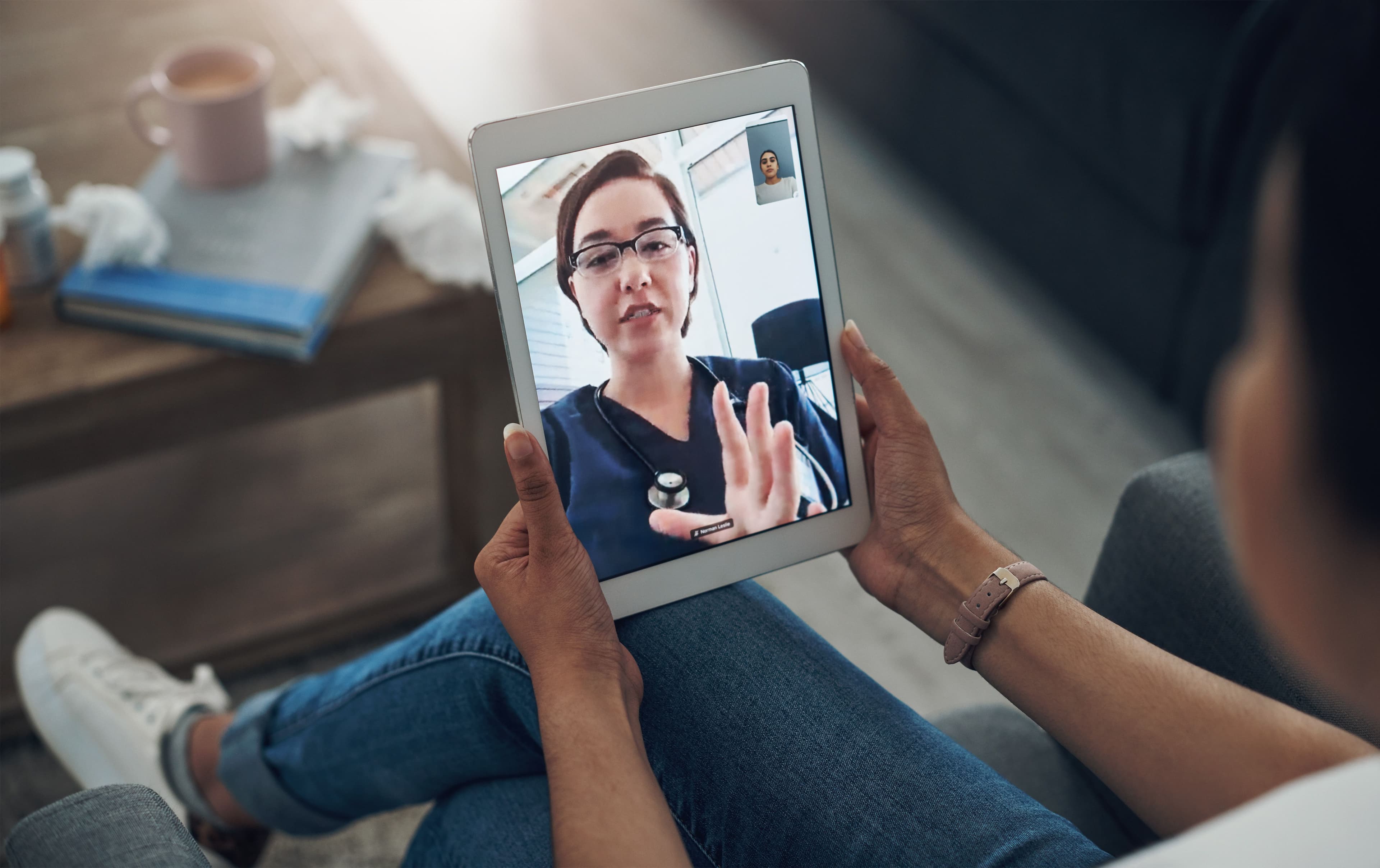 woman holding a tablet w HCP talking to her | image credit: ©jeff bergen/peopleimages.com  stock.adobe.com