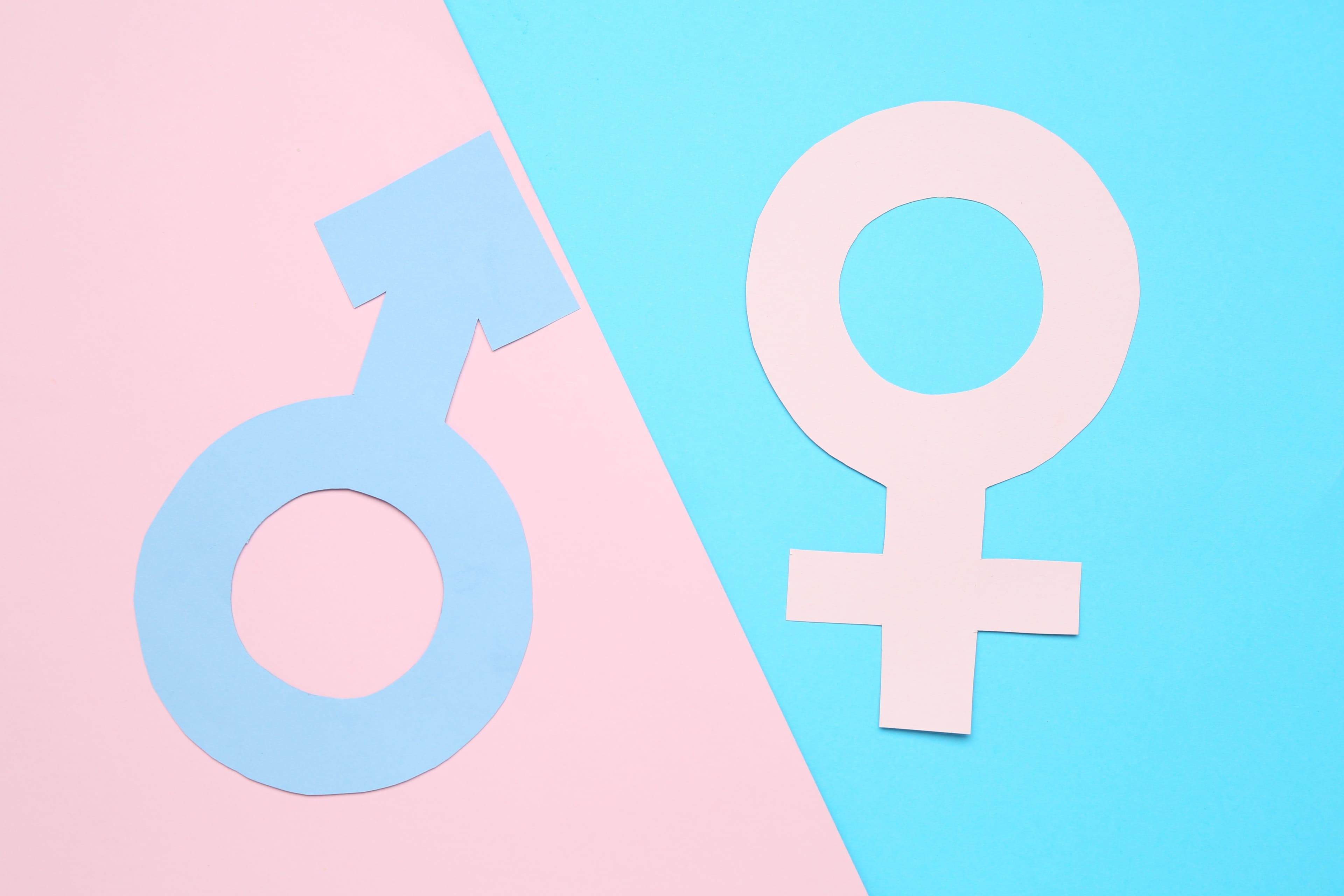 gender symbols on pink and light blue backgrounds | Imaged credit: ©new africa stock.adobe.come