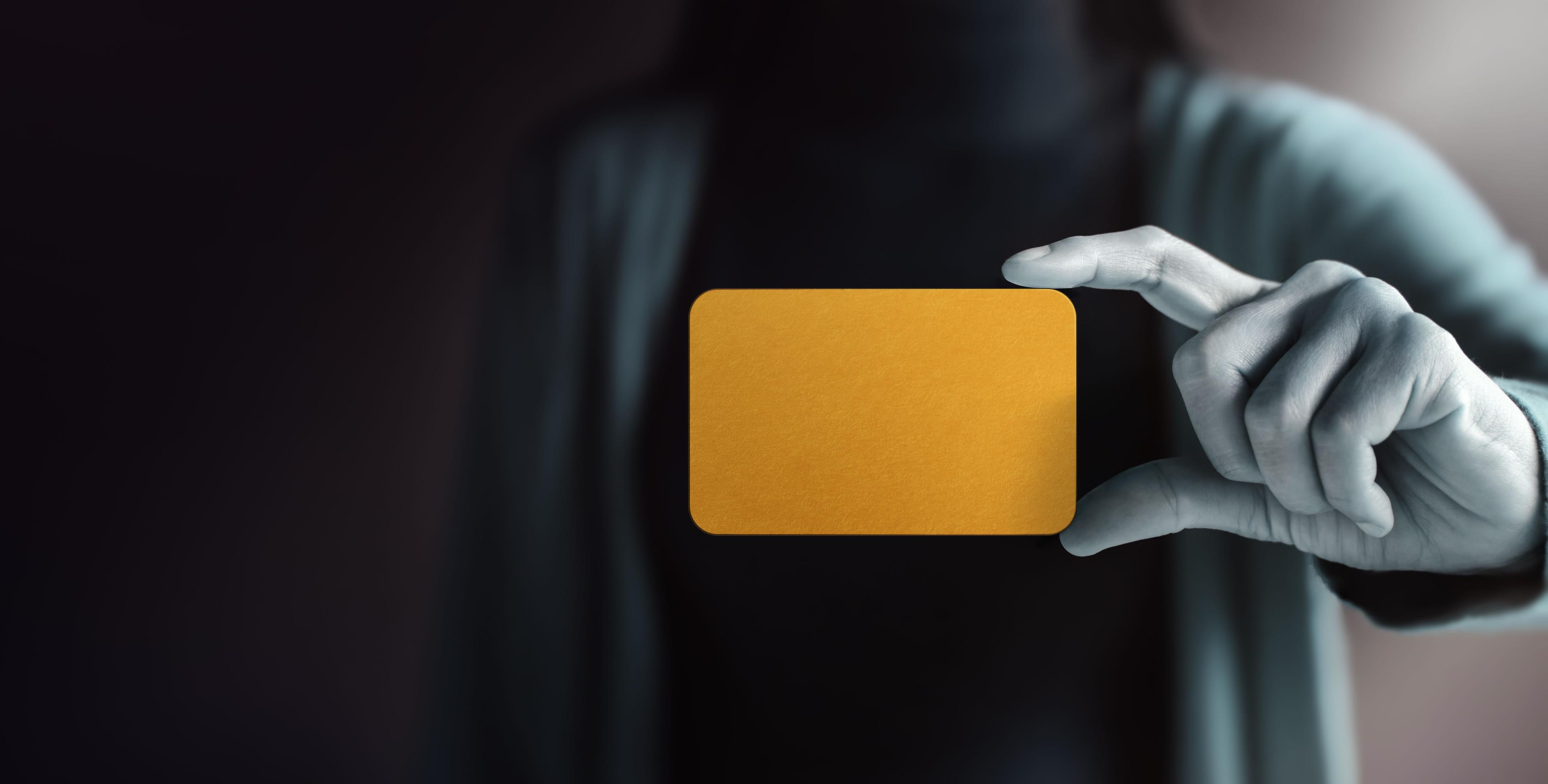 person holding a blank gold card | Image credit: ©blacksalmon stock.adobe.com