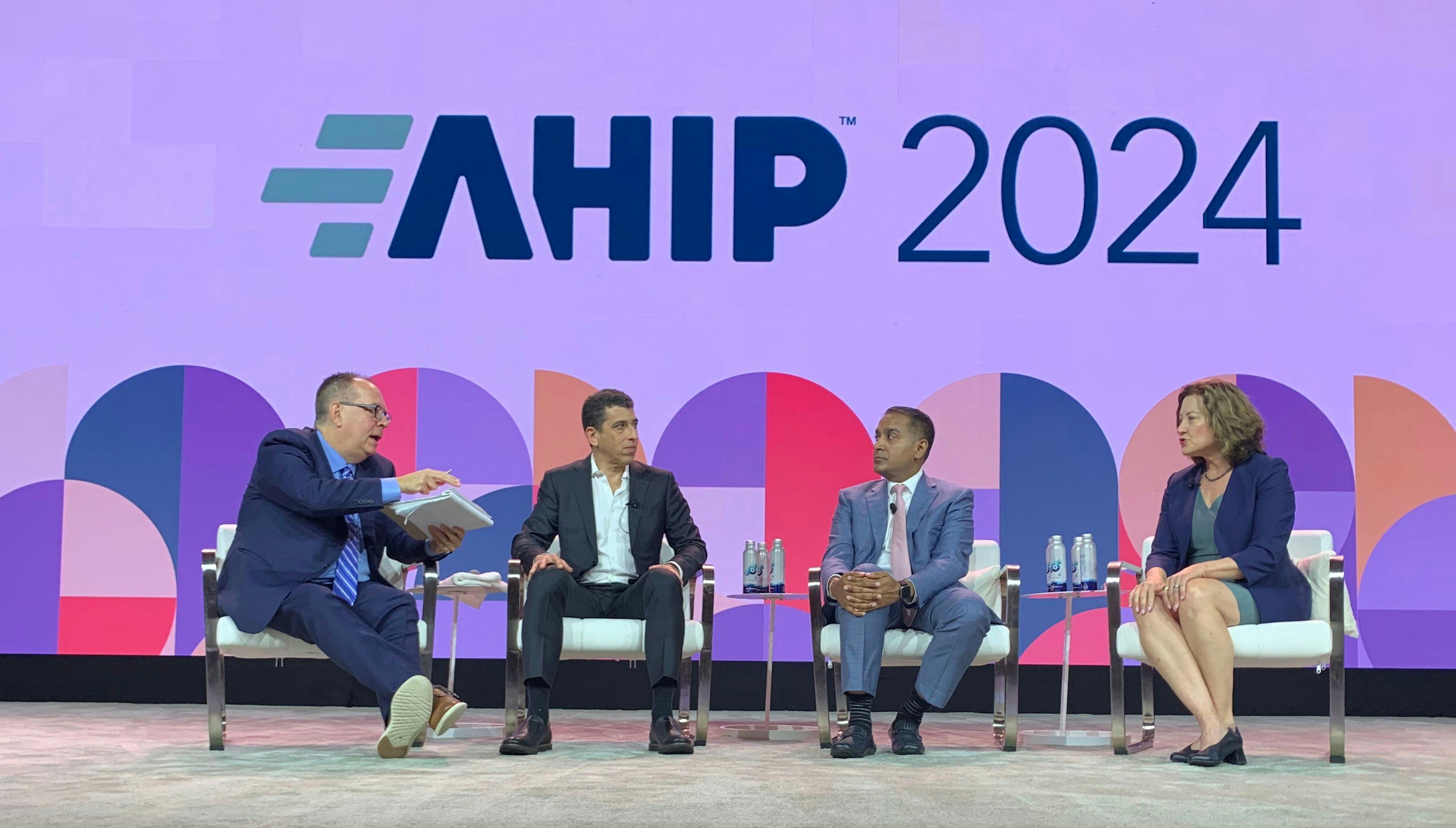 A keynote session onat AHIP on reimagining healthcare (from left): moderator Bruce Japsen, Dan Mendelson, M.P.P.; Sachin Jain, M.D., MBA;
and Andrea Walsh, J.D.