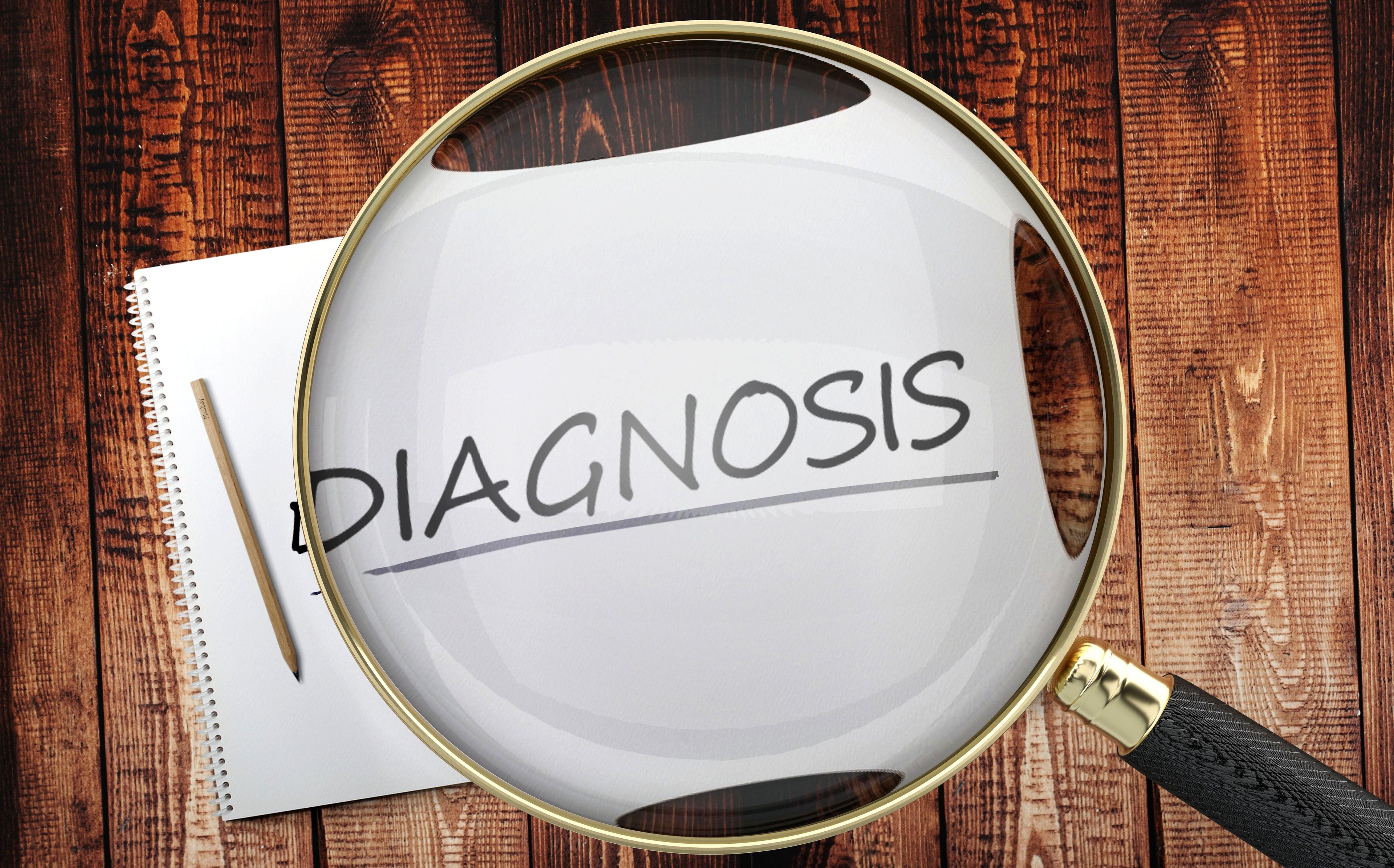 The word diagnosis under a magnifying glass | Image credit: @Goodieas stock.adobe.com