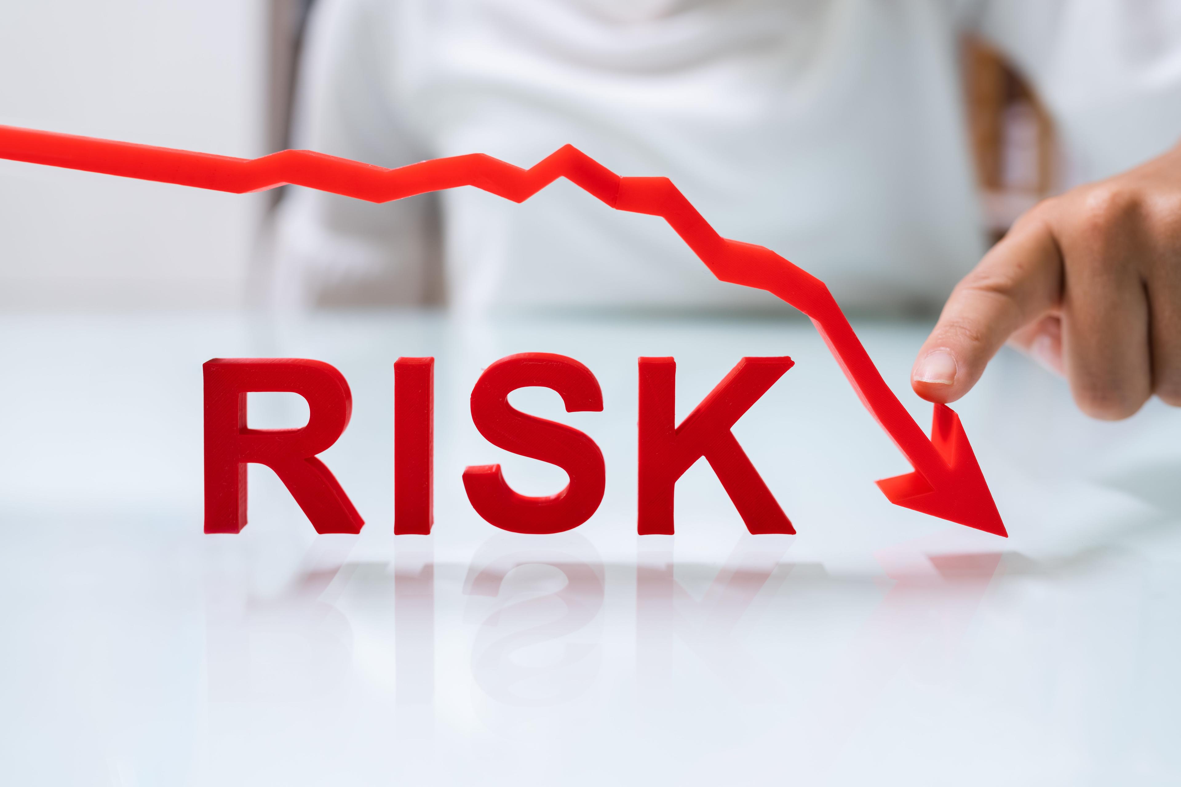 Word risk in red and downward arrow | Image credit: ©Andrey Popov stock.adobe.com