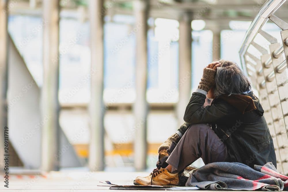 homeless person looking sad | Image credit: ©Thongchai  stock.adobe.com